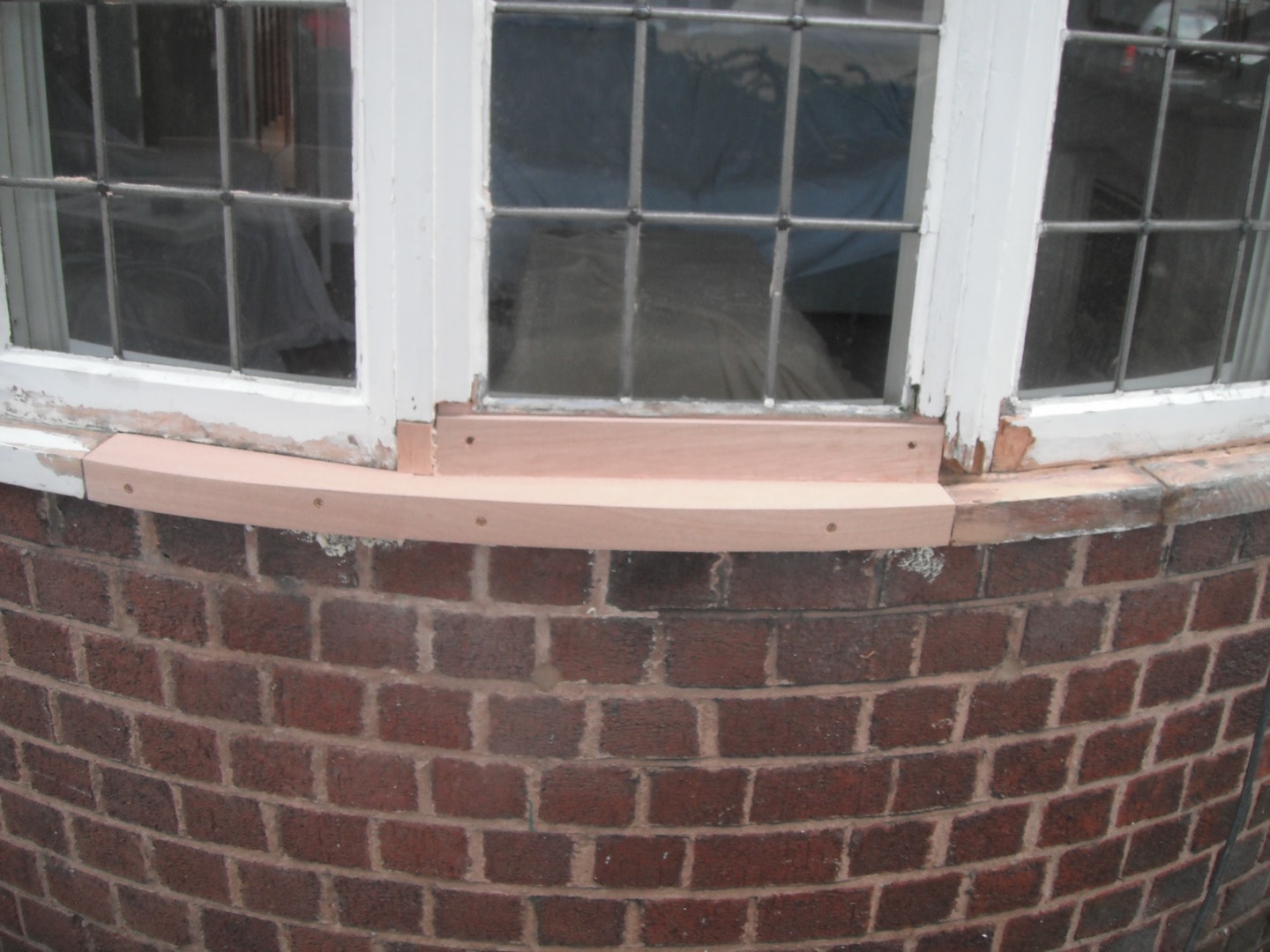 New timber sill fitted to curved bay casement window