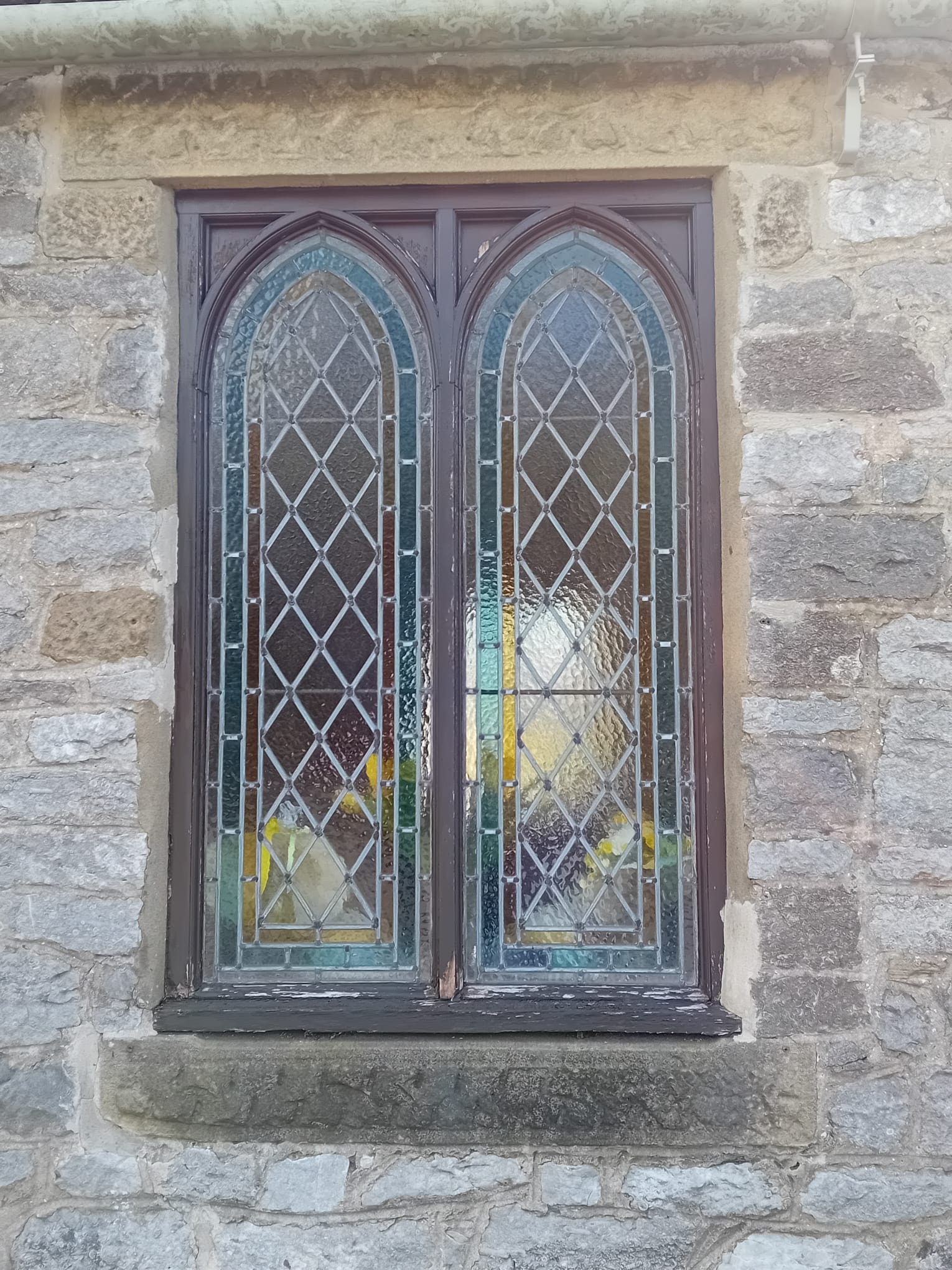 St Hughes Church Foolow — gothic leaded window before restoration in stone wall