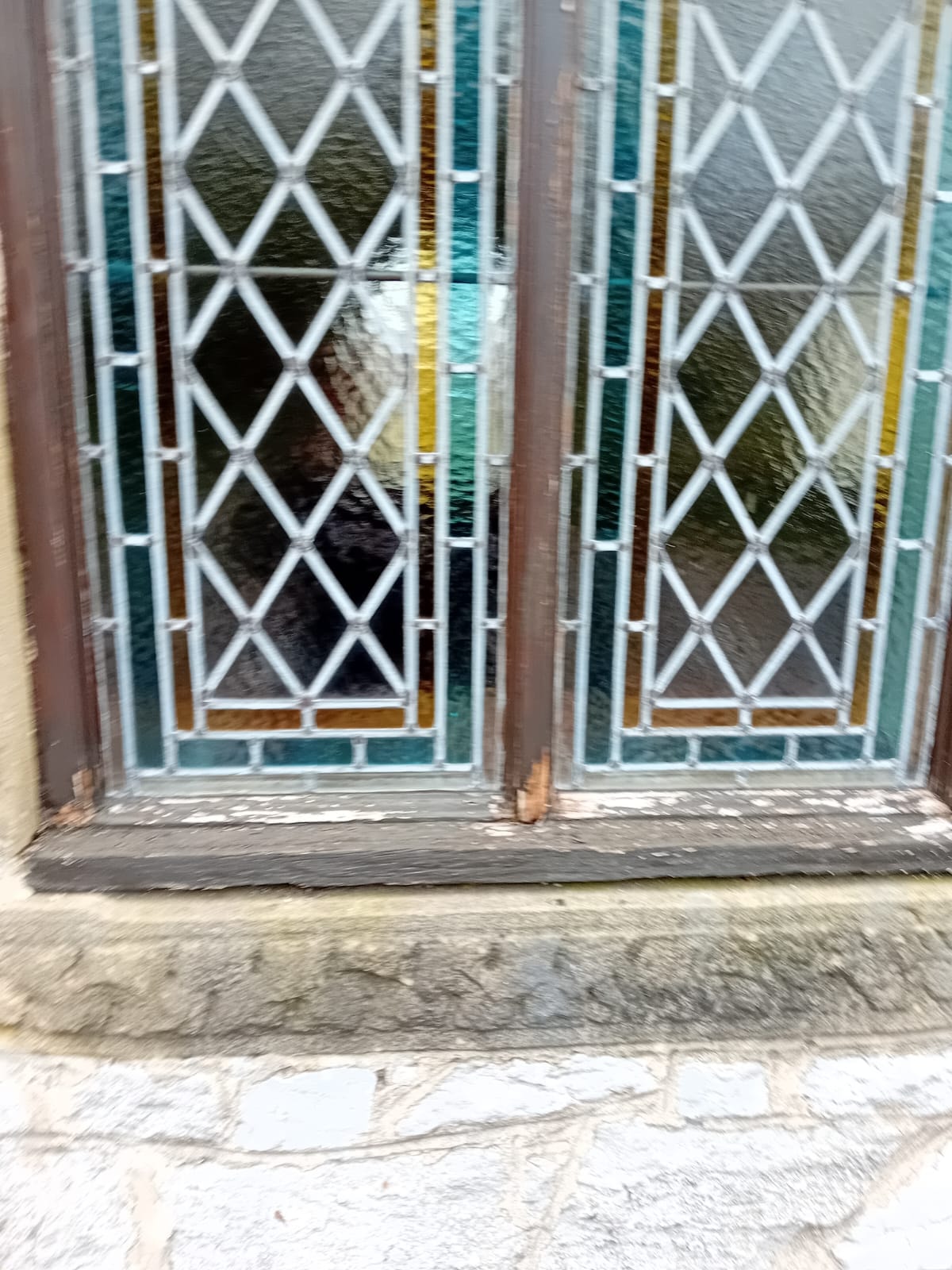 St Hughes Church Foolow — close-up of leaded glass and rotten sill before restoration