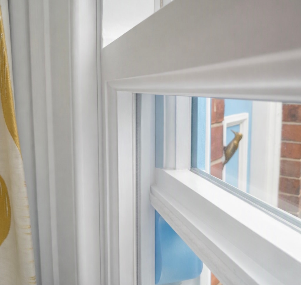 White sash window interior showing channel and draught proofing seals
